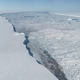 Who’s up for a swim!? Larsen C ice shelf (left) and iceberg A-68A (right). (Image: NASA/Nathan Kurtz)